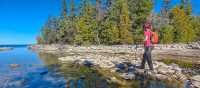 Hiker along the shoreline of Georgian Bay | Pete Heck