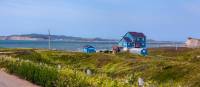 Pass by colourful houses while hiking the archipelago | André Quenneville