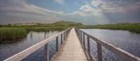 Take a stroll on this floating boardwalk to a quiet white sand beach | Sherry Ott