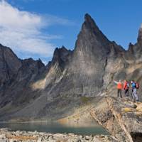 A captivating mountain range by a pristine lake in Tombstone Territorial Park | Government of Yukon/Fritz Mueller